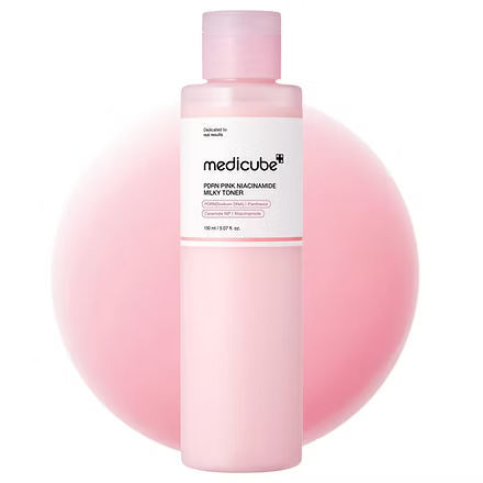 Pink bottle of Medicube product on a white background