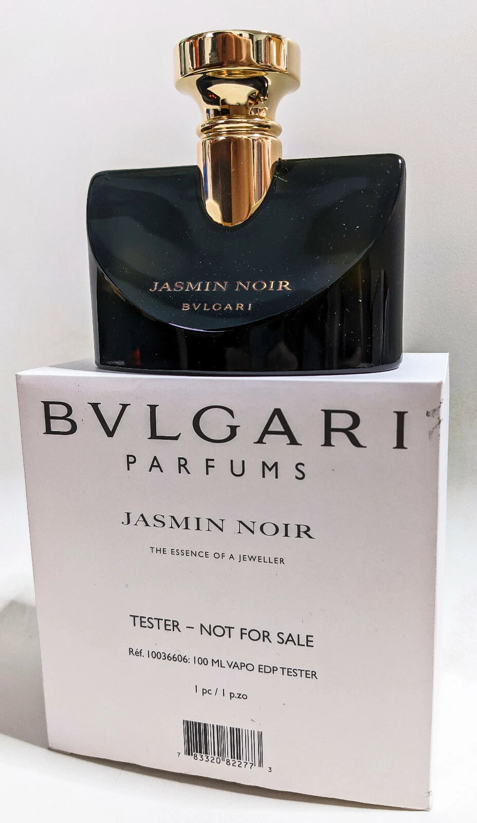 Bulgari Jasmin Noir perfume bottle with packaging on a white background