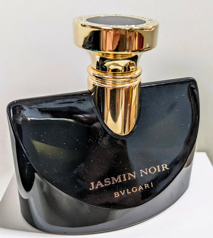 Bulgari Jasmin Noir perfume bottle with gold cap on a white background