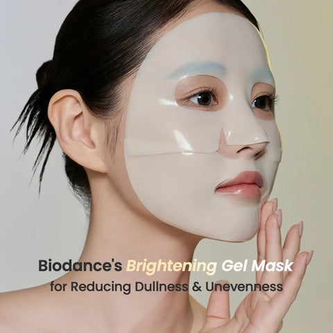 Woman wearing a Biodance brightening gel mask on a plain background